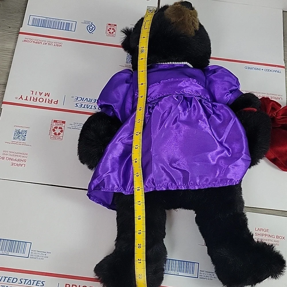 Bronner's Ditz Design Plush Bear wearing pearls and purple dress